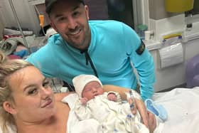 Mollie Dougherty, her baby Tommy, and her partner Tom Dougherty. Mollie had a tumour removed from her jaw just eight hours after giving birth - after being diagnosed with cancer at 37 weeks pregnant.