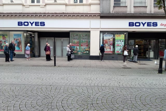 Customers keep to the social distancing advice as they queue for Boyes.