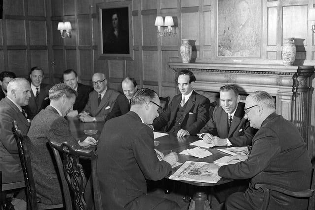 Scotsman proprietor  Roy Thomson meets with editor Alistair Dunnett and staff in The Scotsman boardroom in July 1958.