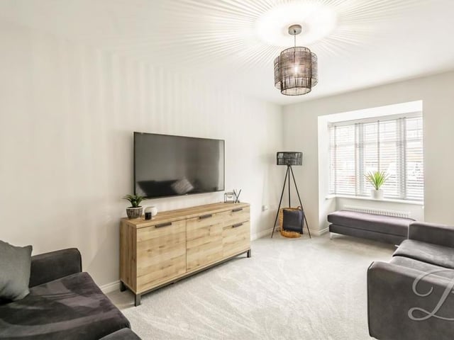 Let's move in to the relaxing living room, which is the ideal place to spend a night in front of the TV. It has a carpeted floor, a central-heating radiator and a window to the front of the property.