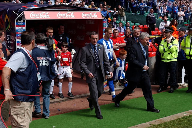 Martin Scott leads the Pools team out at Cardiff.