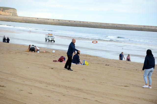 Families enjoy a game of frisbee at Sandhaven Beach in South Shields.