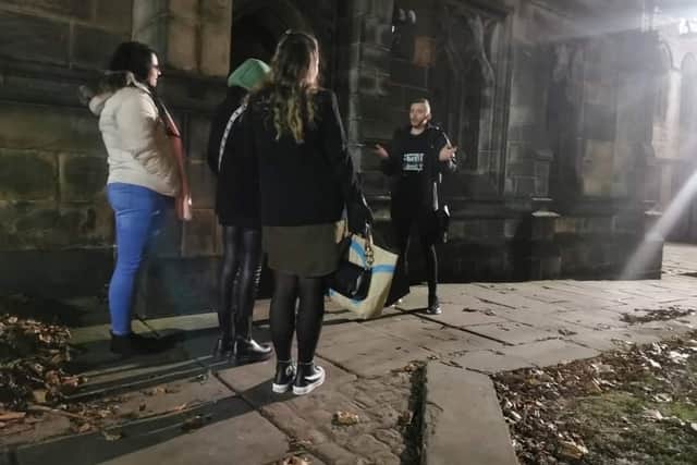 David Hunter with the visitors during one of the ghost walks he runs in Sheffield