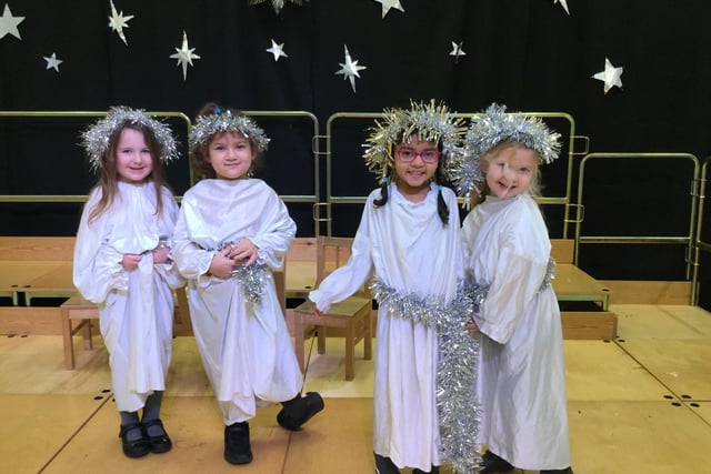 Schoolgirls from St John Fisher Primary school as angels in their sparkling costumes