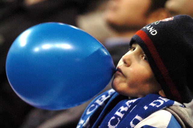 A young Owls fan shows his colours against United at Bramall Lane in December 2005.