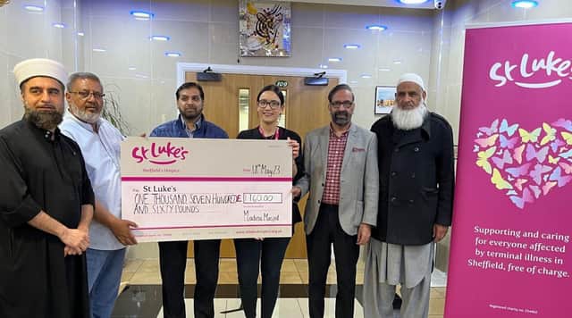 Ellie Matthews with members of the Madina Masjid Mosque committee