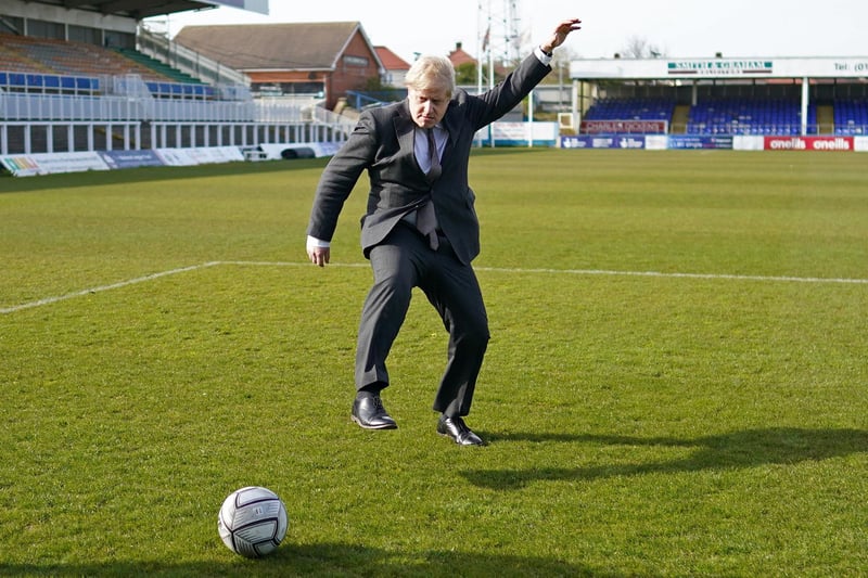 Britain's Prime Minister Boris Johnson practices his skills during a visit to Hartlepool United Football Club as he campaigns on behalf of Conservative Party candidate Jill Mortimer in Hartlepool, north-east England on April 23, 2021, ahead of the 2021 Hartlepool by-election to be held on May 6. (Photo by Ian Forsyth / POOL / AFP) (Photo by IAN FORSYTH/POOL/AFP via Getty Images)