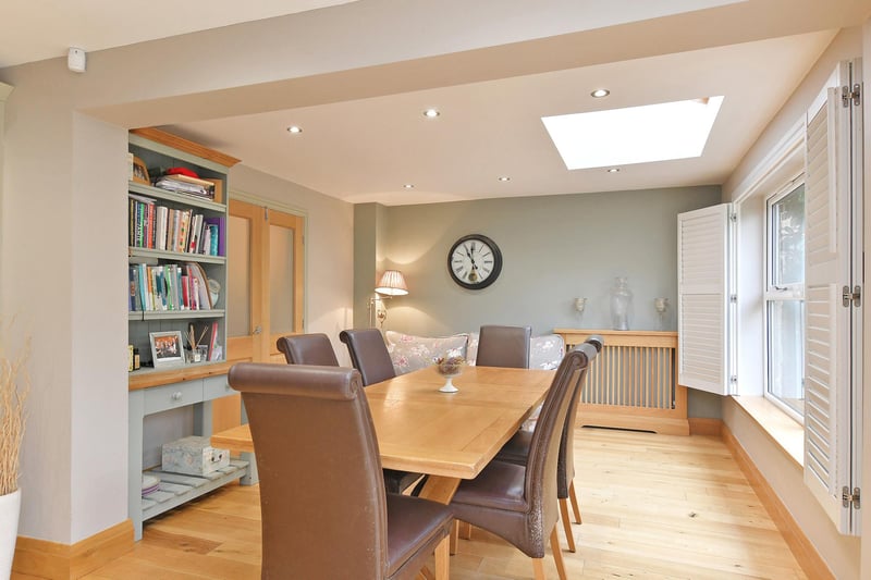 The dining room is light thanks to two Velux roof windows and rear facing double glazed windows with fitted shutters. It also has recessed lighting, central heating radiator with a decorative cover and oak flooring with under floor heating.
