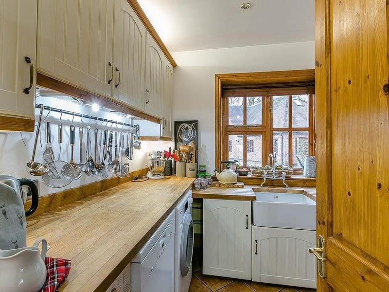 Here is the utility or laundry room, just off the kitchen. Handy, isn't it?
