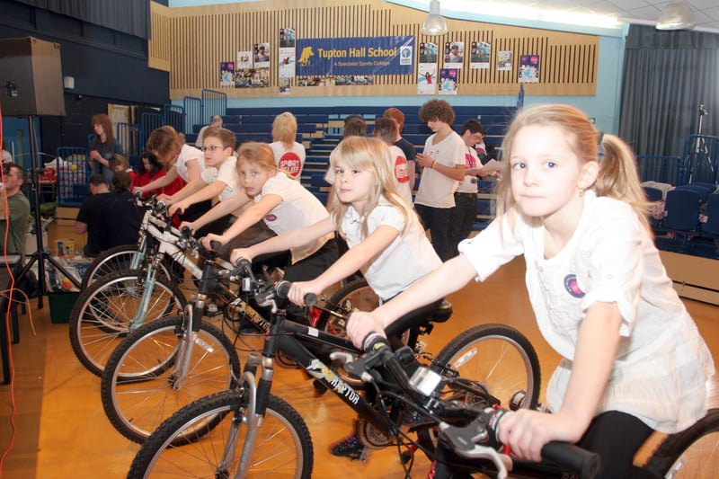 Pupils from Holmgate Primary School pedal hard to create enough energy to power a band's equipment as part of Sport Relief at Tupton Hall School in 2010.