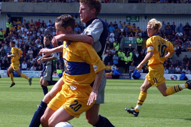 Stags' Scott Sellars and Chesterfield's Gareth Davies during the Spireites' 2-0 away win in August 2002.