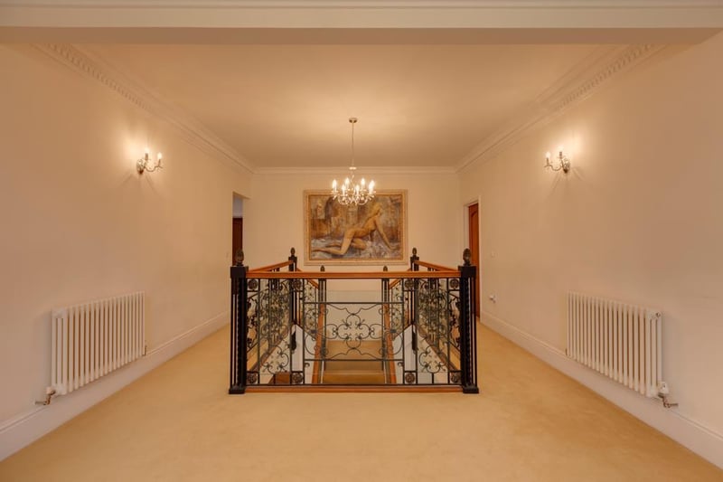 The first-floor landing is described as a "fantastic galleried landing", with a feature, front-facing upvc double-glazed sash window with an arched panel above and matching side panels.