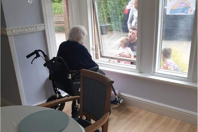 Faces at the window, Betty enjoying her 98th birthday with a visit from her Grandchildren and Great Grandchildren.