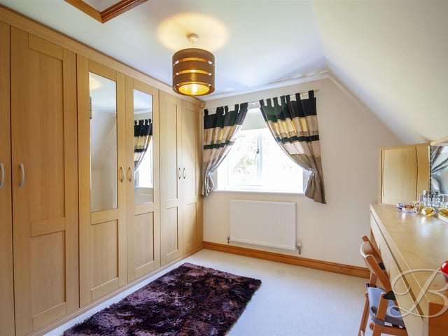 A dressing area in bedroom one, on the first floor.