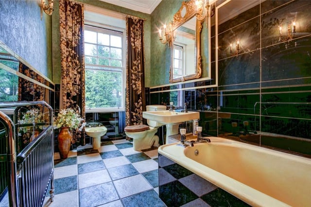 The beautiful art-deco family bathroom is one of three within the property.