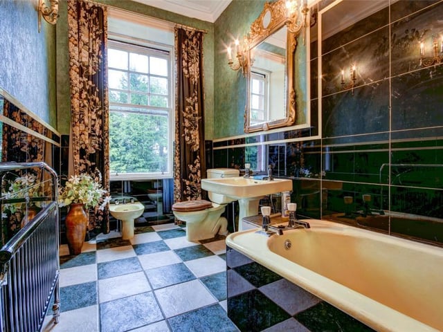 The beautiful art-deco family bathroom is one of three within the property.