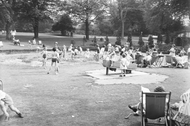 Youngsters playing on the playground in the Gardens