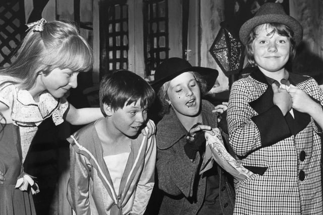 A lovely scene at St James RC Primary School in 1981. Fagan (played by Maura Connelly), teaches Oliver (Calum Samuels) the tricks of the trade, picking the pocket of the Artful Dodger (Anne Duffy), watched by Nancy, (Vickie Phelan).