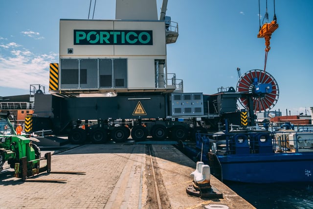The arrival of a new 432-tonne mobile harbour crane at Portico is captured.