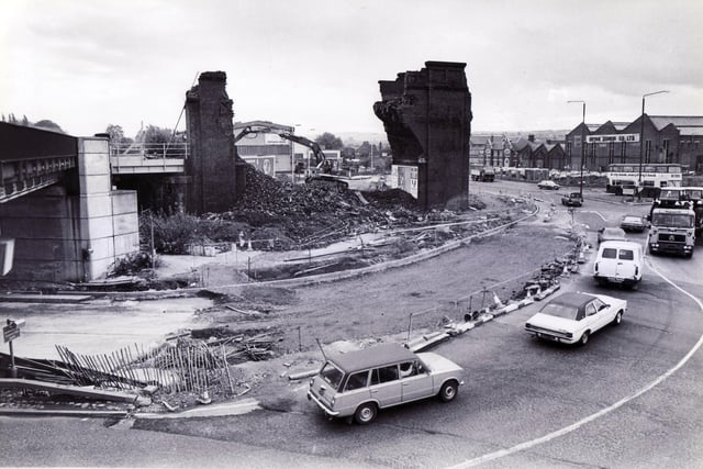 Chesterfield then and now. Demolition of the old Horns Railway Bridge, Chesterfield, once part of a railway viaduct which straggled the  main Derby Road, now being removed to make way for the new by-pass - 23rd October 1984