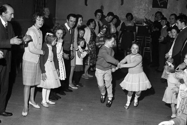Youngsters enjoy the RAF Association's Children's Christmas Party in the Grassmarket in January 1964.