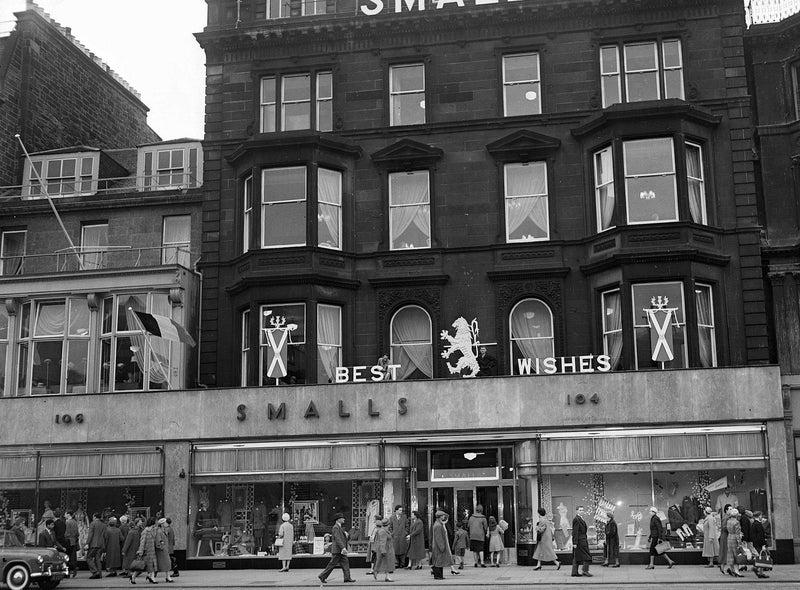 Smalls department store, owned by House of Fraser, closed its doors in 1977. In this photo, you can see a Royal wedding best wishes sign above the store, in 1960.