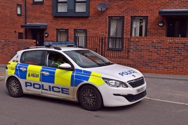Police outside a home on Errington Avenue, near Arbourthorne, Sheffield, where a drive-by shooting was reported