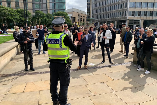 Police warn protestors in Sheffield's Peace Gardens that they're in violation of health restrictions, ahead of the protest at 12pm on Saturday