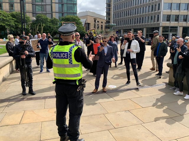 Police warn protestors in Sheffield's Peace Gardens that they're in violation of health restrictions, ahead of the protest at 12pm on Saturday