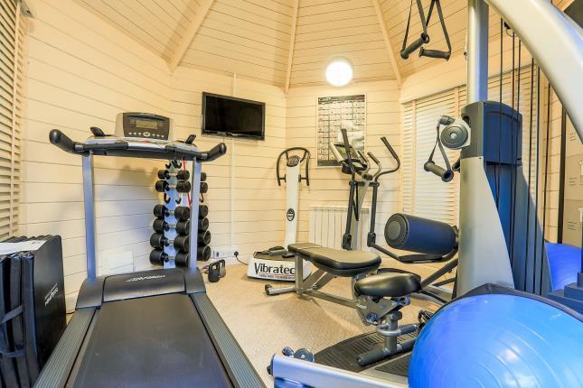 A multi-functional room in the garden is currently used as a gym.
