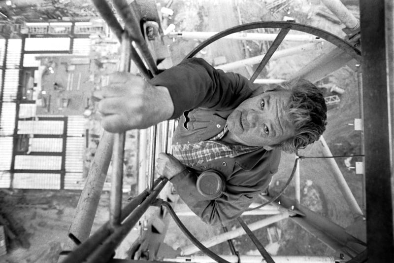 John Cashman, one of the men working at the Greenside Place building site where a new Hospitality Inn was being constructed, climbs the 160ft ladder into his crane in November 1989.
