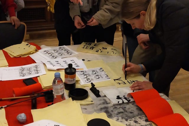 Families got to try their hand at Chinese calligraphy.
