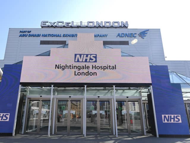 Newly installed signage for the field hospital to be known as the NHS Nightingale Hospital being created at the ExCeL London exhibition centre in London. (Photo by Glyn KIRK / AFP)