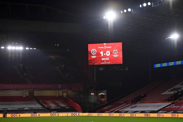 A board displays the final score after the Premier League  match between Sheffield United and Newcastle United at Bramall Lane (Photo by OLI SCARFF/POOL/AFP via Getty Images)