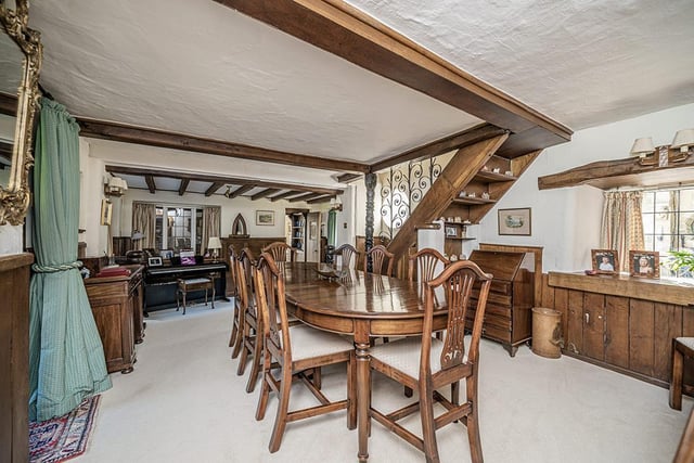 The characterful dining room is large enough to accommodate both family and guests, while the oak beams and panelling lend it that old-worldly charm.