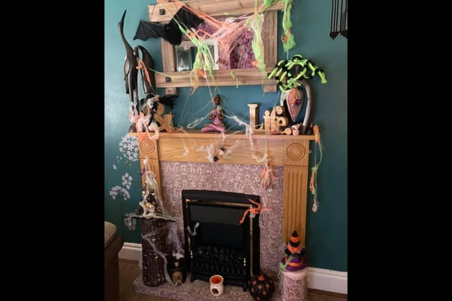Natalie James has decorated her fireplace for Halloween.