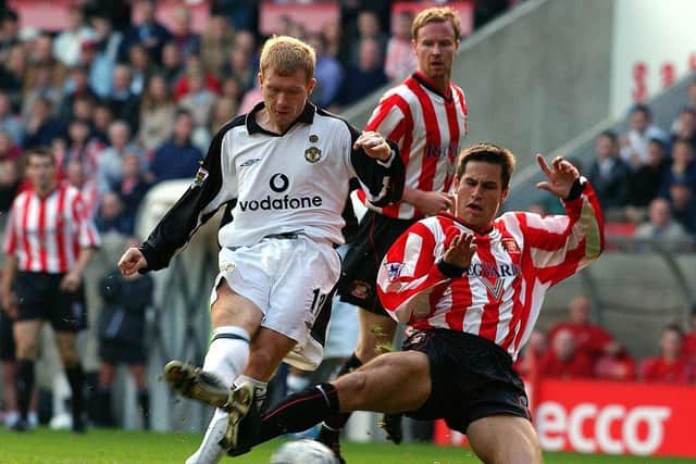 Paul Scholes in action against former Sheffield United and Sunderland midfielder Paul Thirlwell: Manchester United via Getty Images