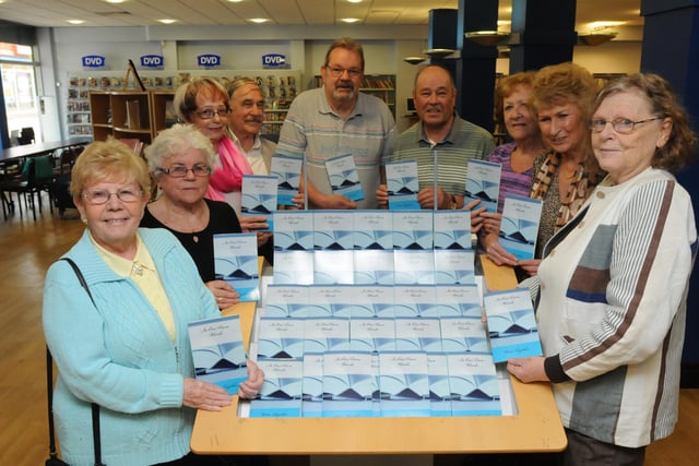 Members of the writing group Write Together were pictured with their new book 7 years ago. Are you in the picture?