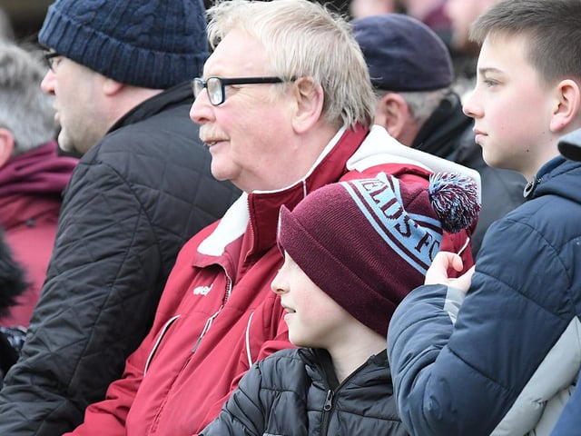 A young supporter shows his colours.