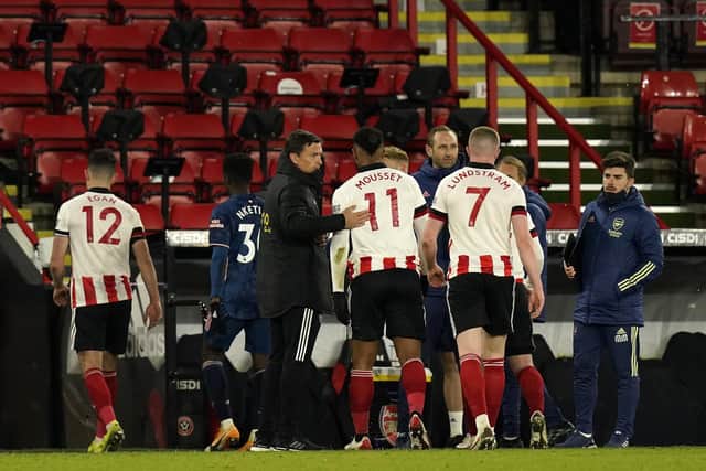 Sheffield, England, 11th April 2021. Paul Heckingbottom temporary manager of Sheffield Utd with Lys Mousset of Sheffield Utd at the final whistle during the Premier League match at Bramall Lane, Sheffield. Picture credit should read: Andrew Yates / Sportimage