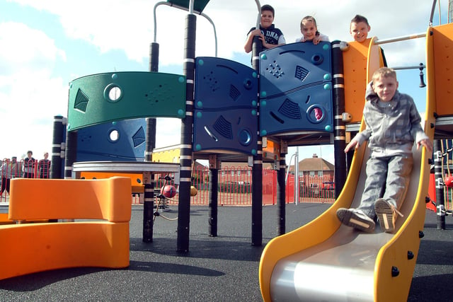 Trying out the new slide at the Manton Community Centre playground in 2009