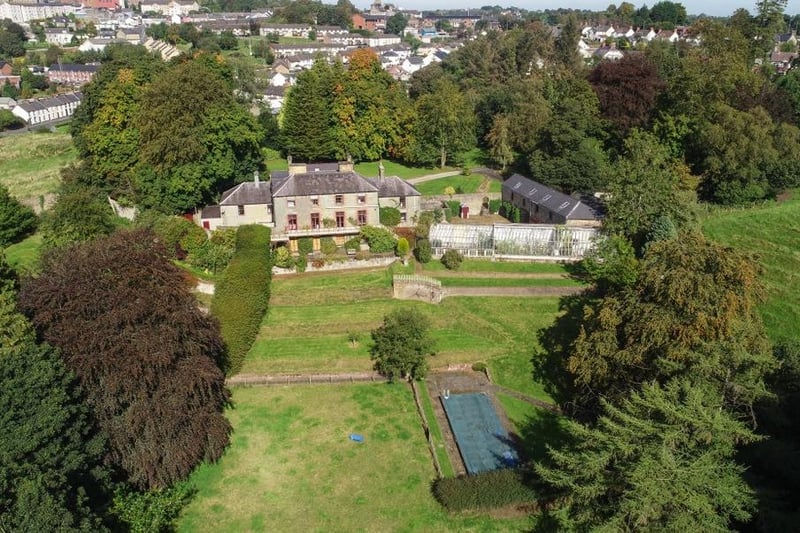 Aerial view showing the swimming pool to the rear of the property.