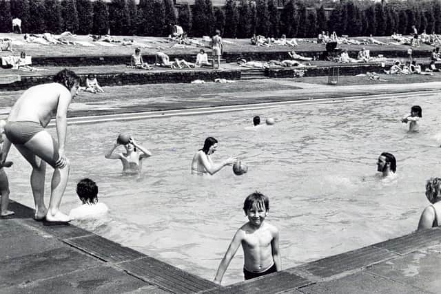Swimmers and sun bathers at Longley Swimming Pool, Sheffield, which was reopened to the public on June 12, 1975