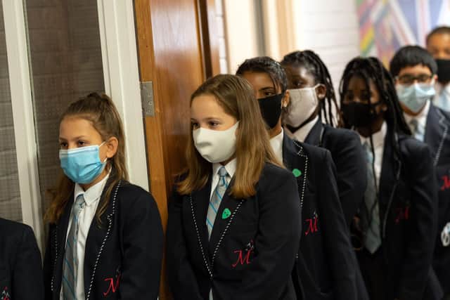 Year eight pupils wear face masks as a precaution against the transmission of the novel coronavirus  (Photo by OLI SCARFF / AFP) (Photo by OLI SCARFF/AFP via Getty Images)