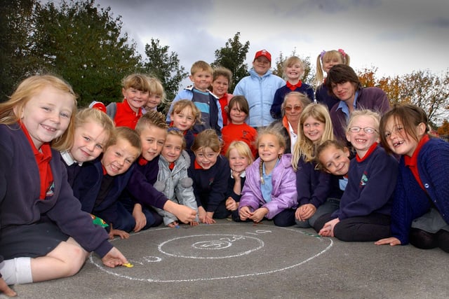 These students were learning how to play traditional games 18 years ago. Who do you recognise in this photo?