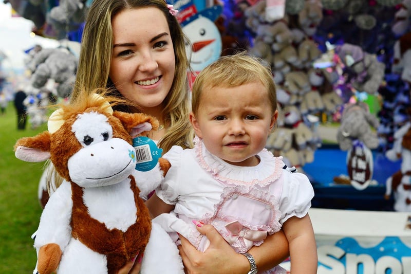 Eienne Smith (12 months) with her cousin Ellie Davis (15) and their prize won at the Hartlepool Carnival.
