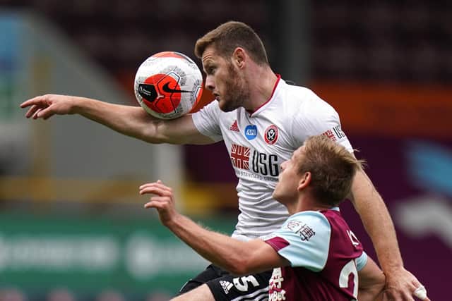 Burnley's Matej Vydra (bottom) and Sheffield United's Jack O'Connell battle for the ball during the Premier League match at Turf Moor, Burnley. Jon Super/NMC Pool/PA Wire.