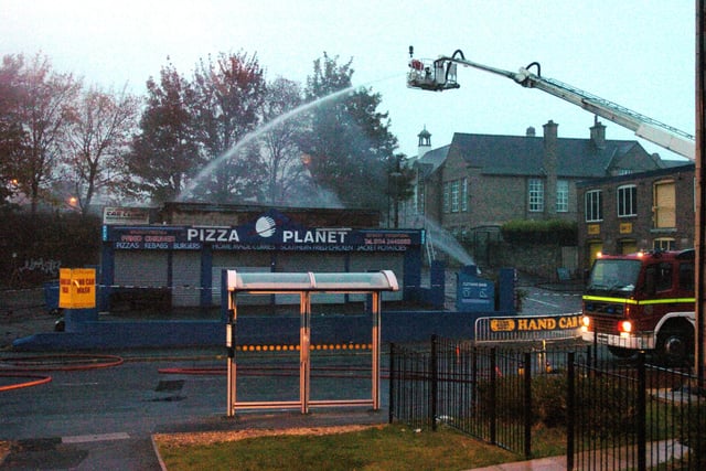 Firefighters damping down after a fire at the Car Clinic on Stanifoirth Road in October 2009
