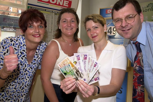 Denise Friel (second left) and Vanessa Worth, both staff nurses in the Neonatal unit at DRI, are pictured collecting the Doncaster's winning charity winnings of £175 from Done Bookmakers in 2000