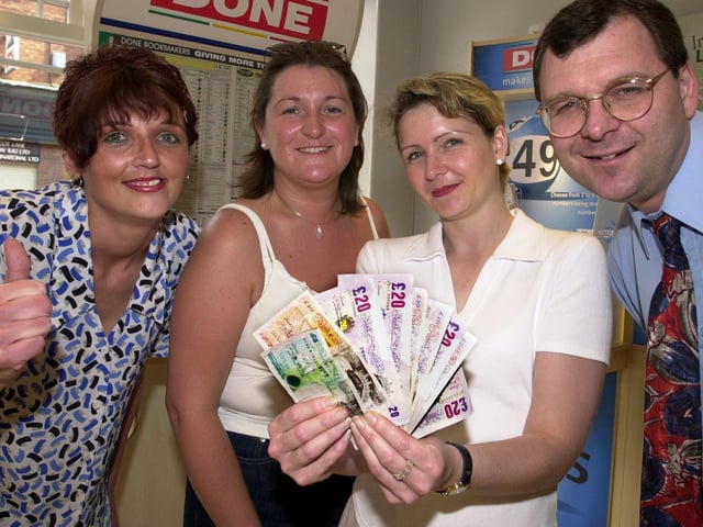 Denise Friel (second left) and Vanessa Worth, both staff nurses in the Neonatal unit at DRI, are pictured collecting the Doncaster's winning charity winnings of £175 from Done Bookmakers in 2000